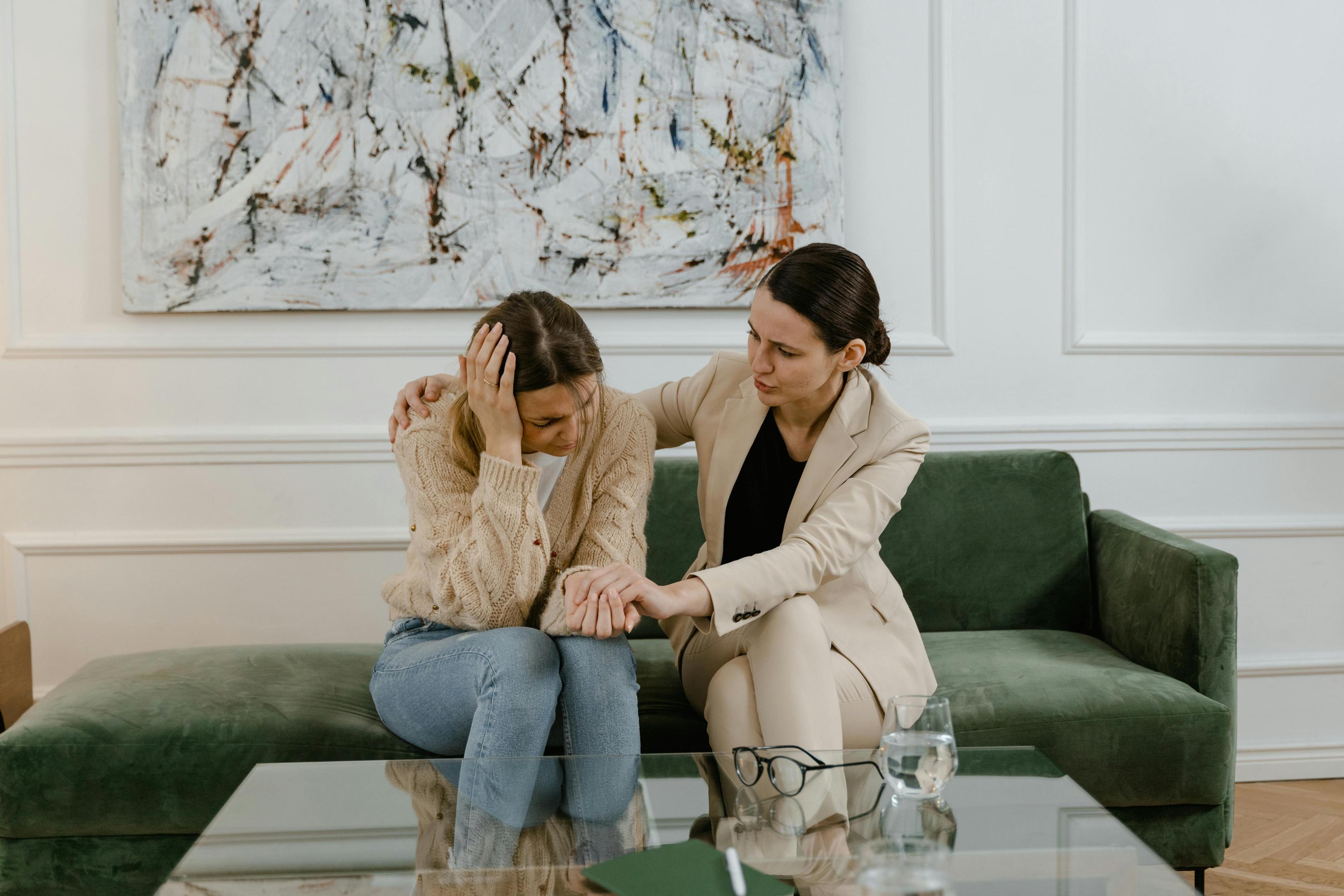 A therapist offers comfort to a client dealing with trauma