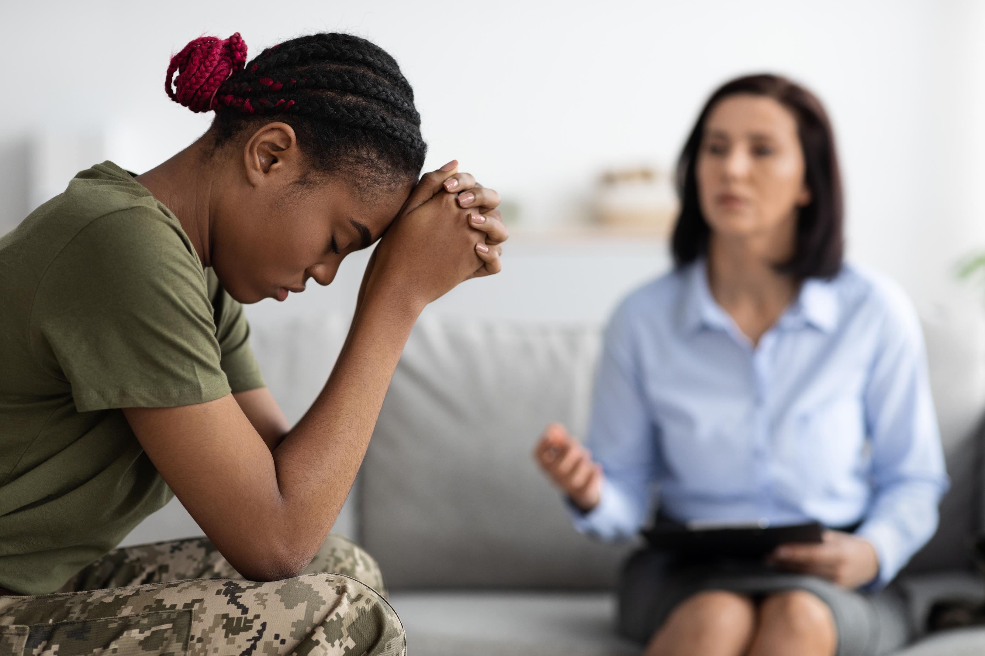 A soldier works through a trauma therapy session