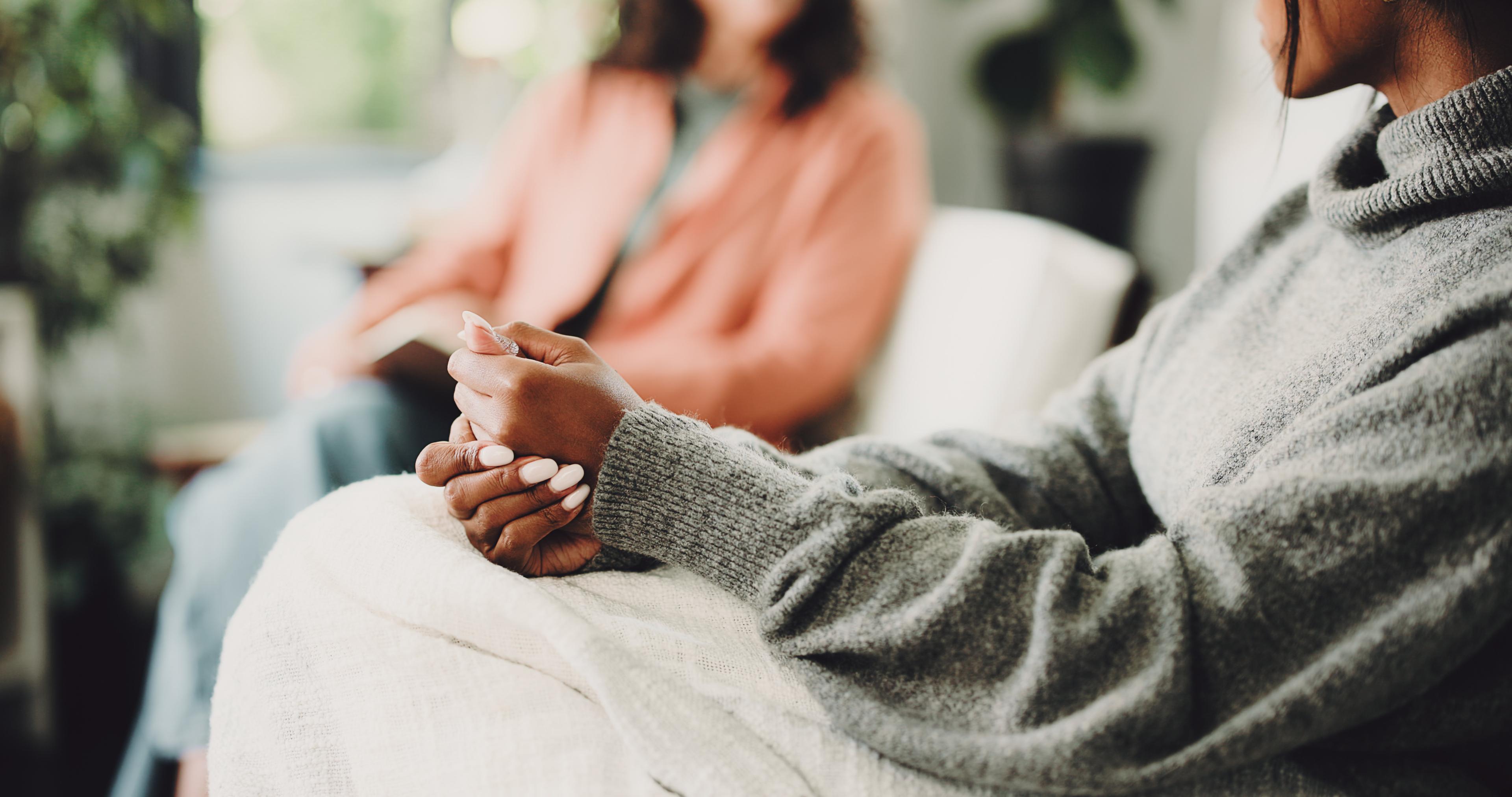 A client dicusses types of trauma therapy with her therapist