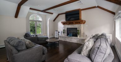 Comfortable living room with a fireplace at a rehab treatment facility in New Jersey